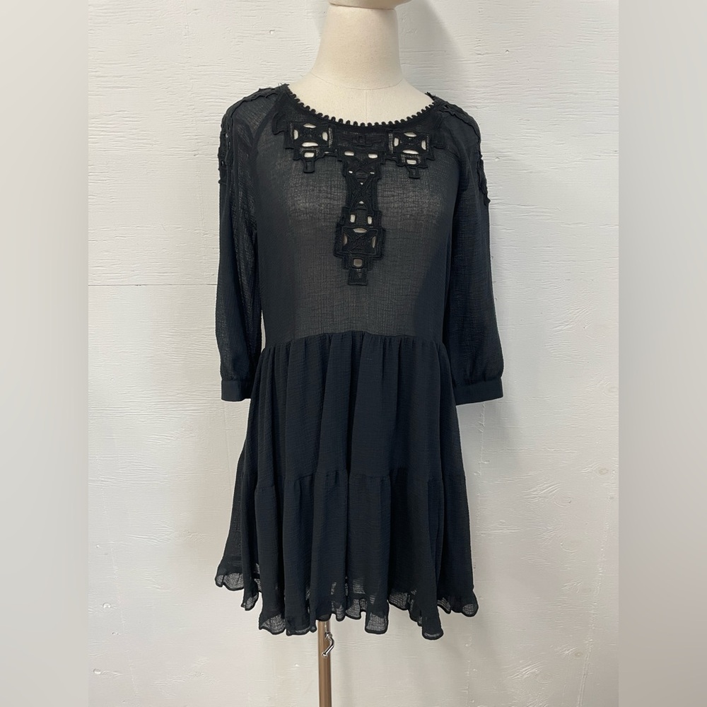 Free People size small dress with cotton motifs.